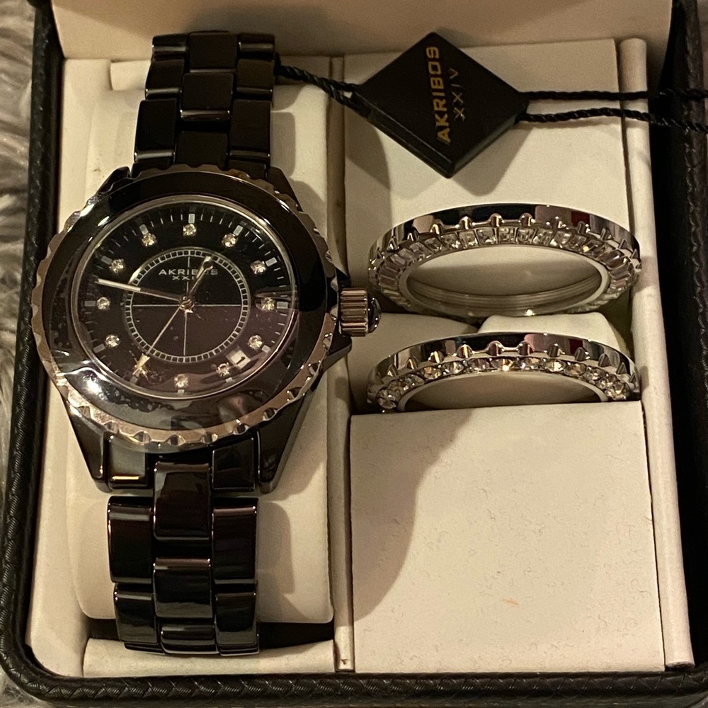 Akribos Crystal Bezel Black Ceramic Ladies
Watch. Interchangeable faces. NWT’s